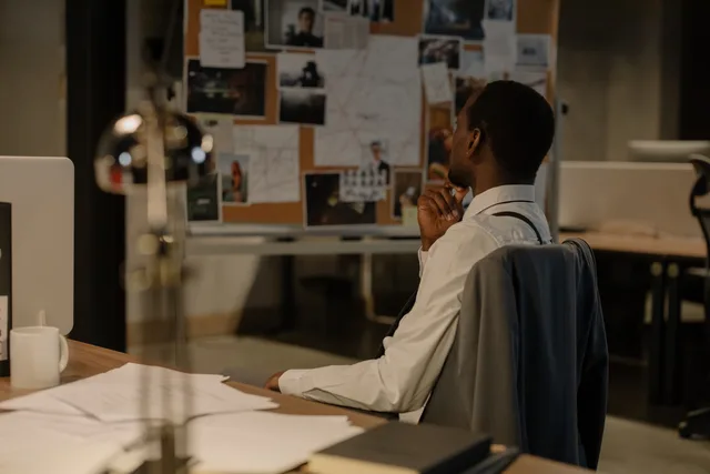 Detective in thought examining evidence board in a dimly lit office environment. Why social media agencies supplier comparison needs a process