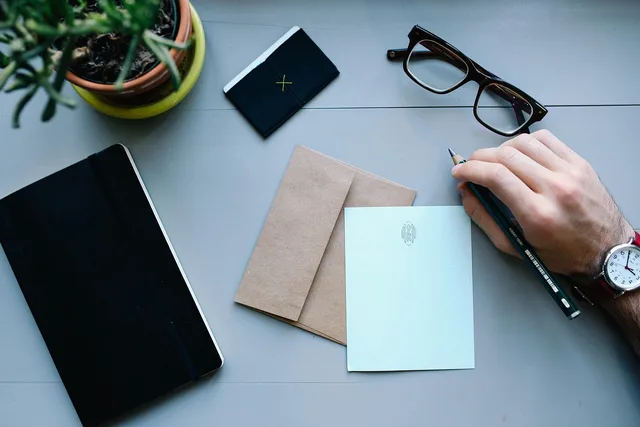 hand, man, watch, work, desk, workspace, people, business, male, person, businessman, letter, envelope, pen, writing, notebooks, business, business, letter, letter, letter, letter, letter, envelope, writing. IR35 and HMRC off-payroll rules for UK social media agencies hiring freelancers
